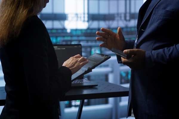 Professionals discussing API integration for cross-border transactions