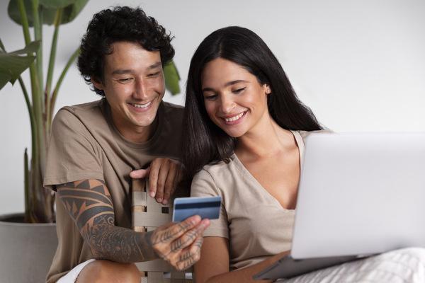 Couple making cross-border payment online securely