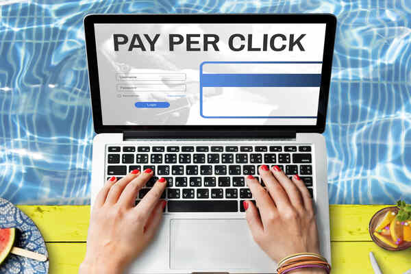 Hands typing on a secure online payment login page for safe money transfers