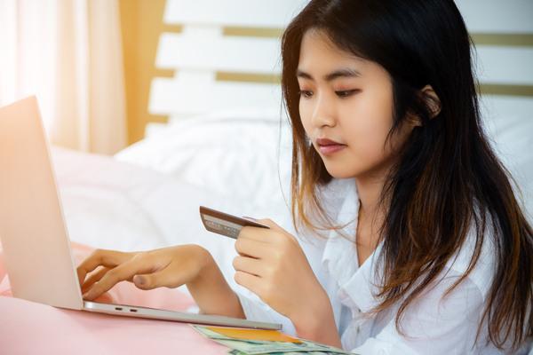 Woman Checking International Transfer Speed Online