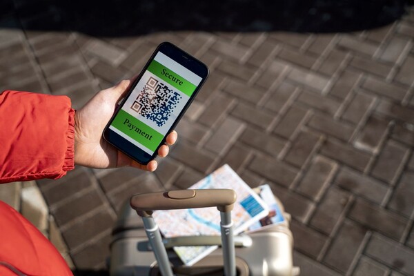 Person using secure mobile cross-border payment