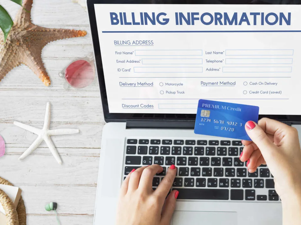 A woman entering credit card details for bill payments online