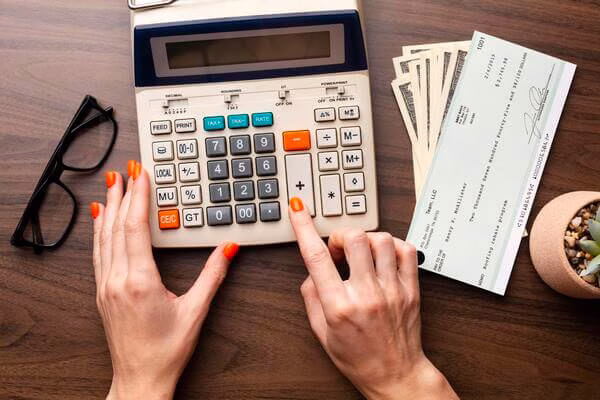 Person computing a check for cashing