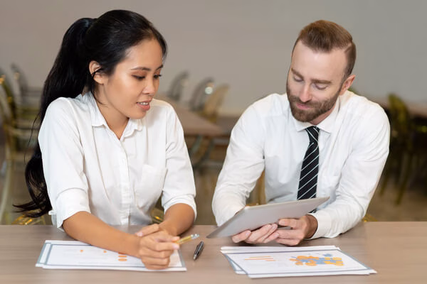 Business professionals discussing the tax on transfers
