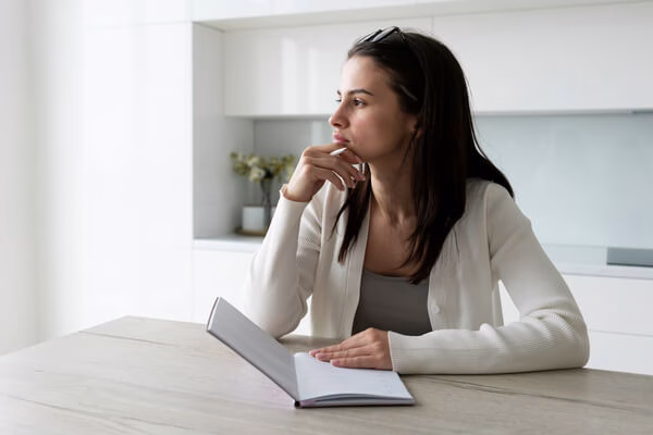 A woman thinking twice before cashing a check