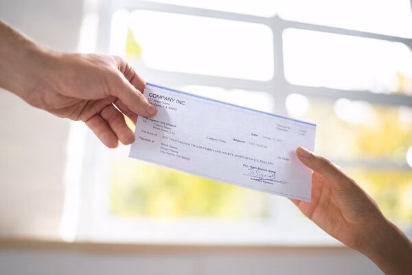 Check cashing handoff with window background.