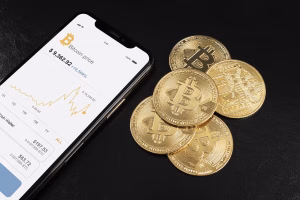 Mobile Bitcoin price chart beside coins symbolizing digital finance