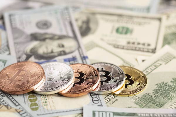Bitcoin ATM concept with cash and crypto coins
