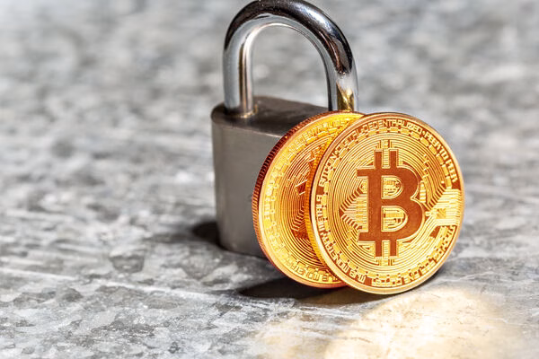 Bitcoin coins with padlock symbolizing ATM security