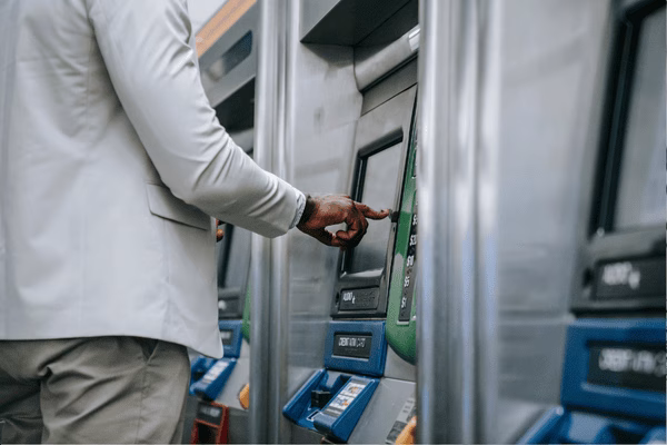 Man interacting with a bitcoin ATM interface
