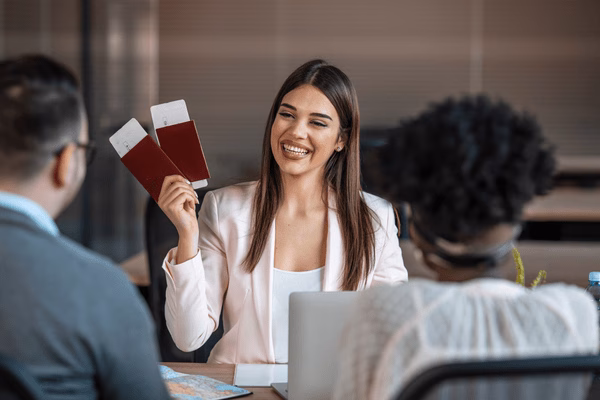 Travel Agent Handing Over Plane Tickets