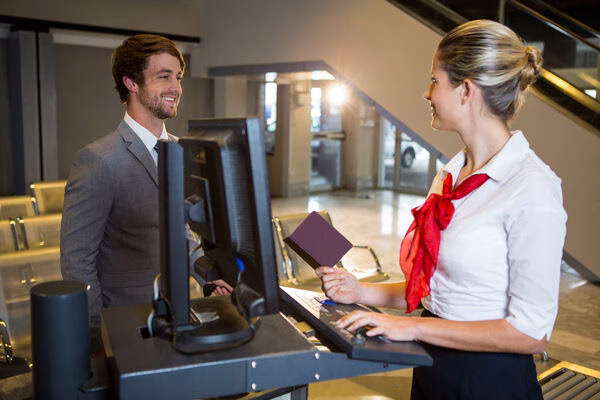 Traveler discussing ticket options at airline counter