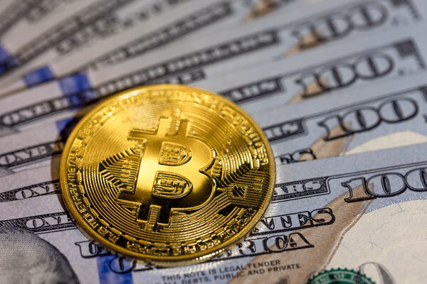 Bitcoin ATM cash-out concept with dollar bills