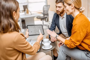 Business team planning Cross Border Payments over coffee meeting.