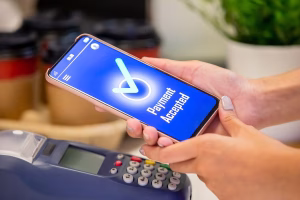 Mobile payment accepted screen demonstrating Cross Border Payments technology.