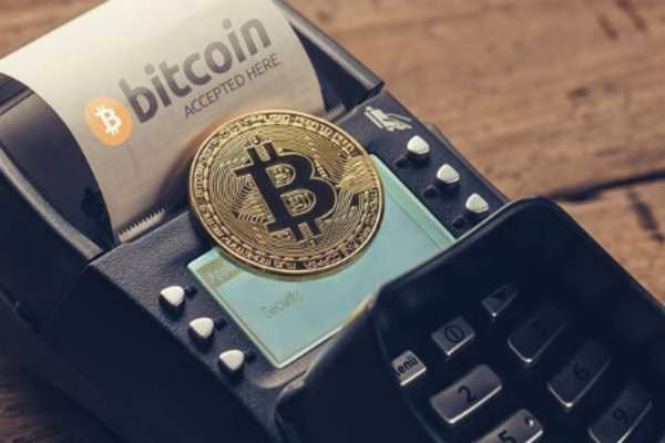 Bitcoin ATM transaction with receipt and coin display