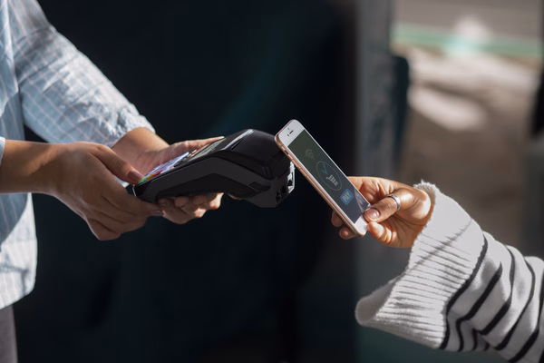 Contactless digital wallet payment across international border
