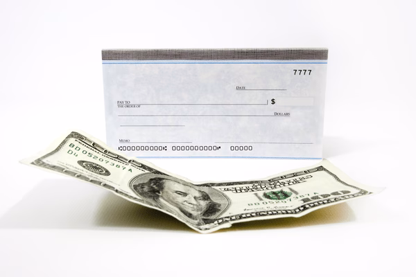 Customer Cashing A Check At Service Counter