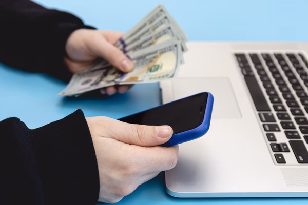 Person handling cross-border money transfer online