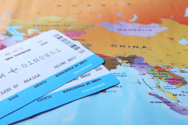 Plane Tickets Placed On World Travel Map