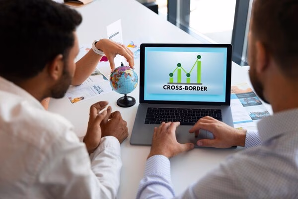 Team analyzing cross-border payments for global business