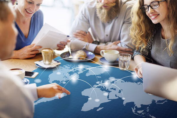 Team discussing seamless cross border payment connections globally