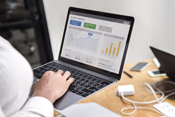 Analyzing cross-border payment data on laptop