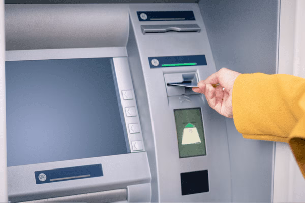 Inserting Bank Card Into Bitcoin ATM Slot