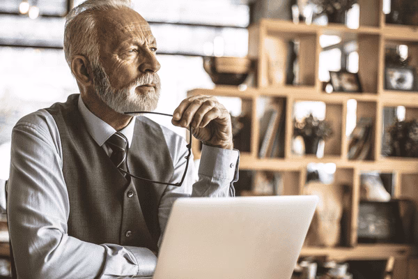 Mature Investor Researching Bitcoin ATM Services
