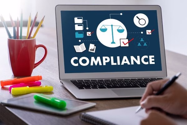  Cross Border Payments compliance displayed on office laptop screen.
