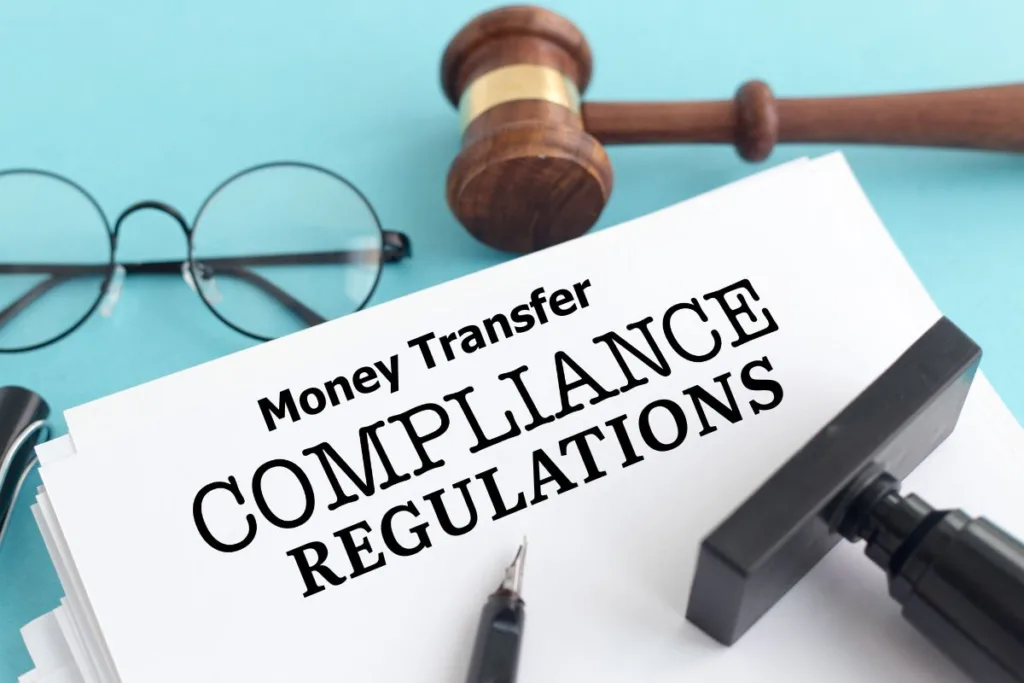 Money Transfer compliance regulations document with gavel and glasses.