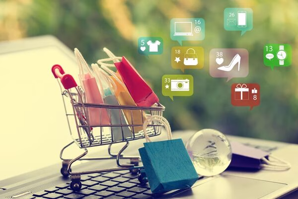 Shopping cart on laptop symbolizes Cross Border Payments convenience.
