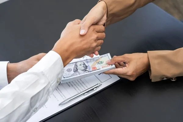 Money Transfer With Business Handshake Agreement