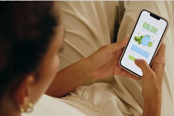 Woman using mobile banking app to explore Check Cashing options