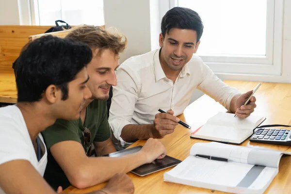 Team reviewing documents for business check cashing process
