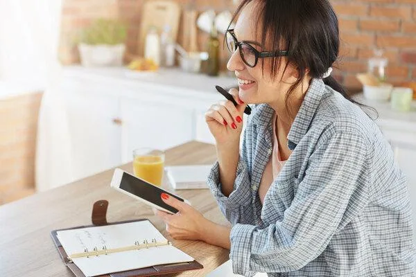 Woman planning finances before cashing a personal check
