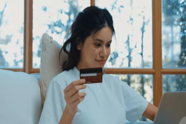 Woman safeguarding finances while using a money order
