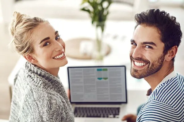 Happy man and woman learning about Money Order services.