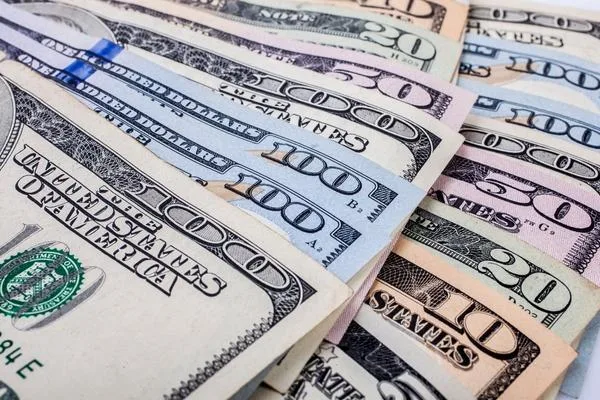 Stack of US dollars prepared for money transfer transaction