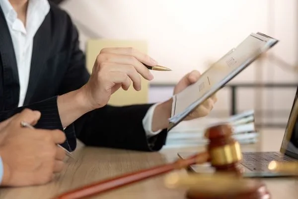 Legal Review Of Money Transfer Documents With Gavel Present