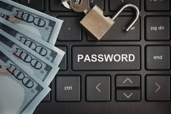Password key with cash showing secure money transfer basics