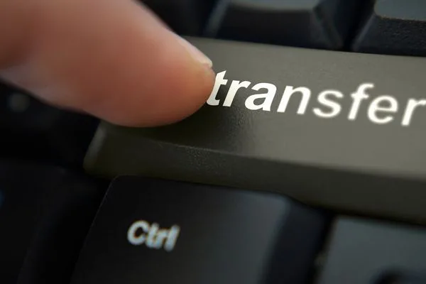 Money transfer action shown through keyboard transfer button