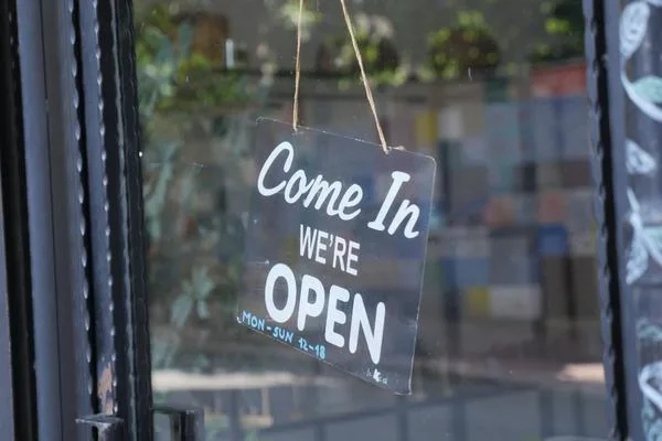 Open Storefront Sign Indicating Available money transfer Services