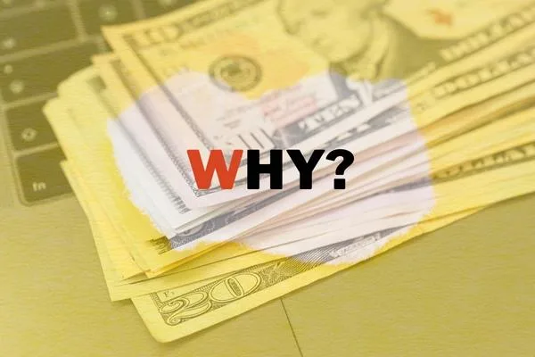 Money transfer questions highlighted over stacked US dollar bills