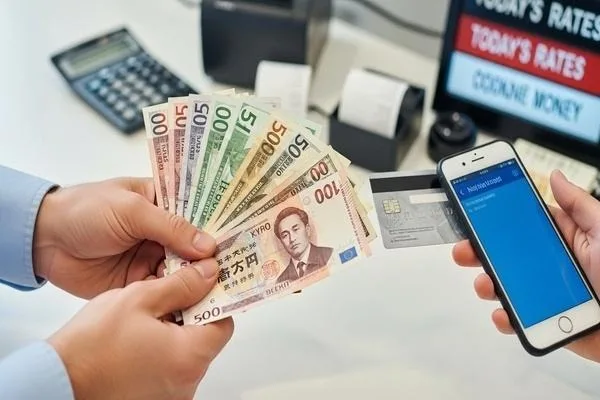 Customer securely exchanging foreign currency using digital payment