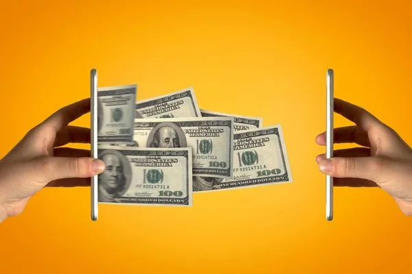 Currency Exchange Transfer Showing Dollars Moving Between Smartphones