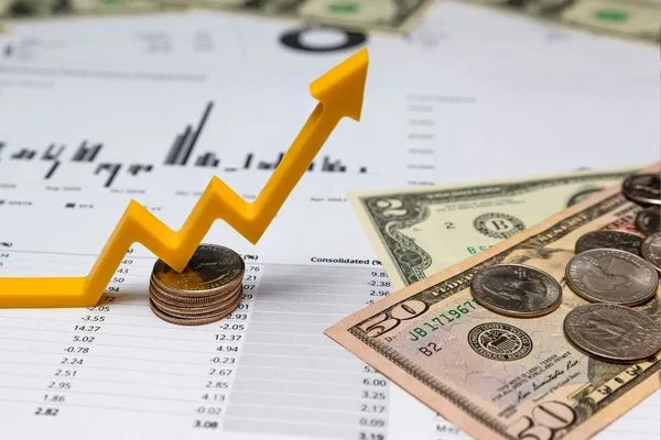 Currency Exchange Trends Shown With Dollar Bills