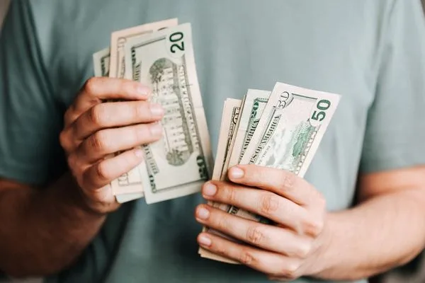 Hands Counting Cash For Currency Exchange Service
