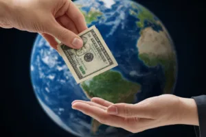 hand sending money transfer from U.S to another part of the globe