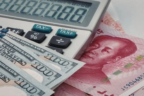 Calculator And Cash With Currency Exchange Rate Display